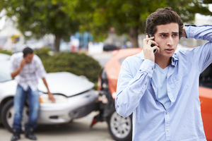 Man on the phone in a car accident