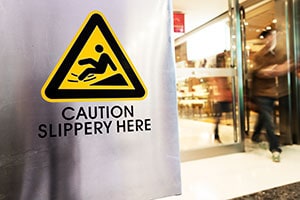 Slippery Here Sign