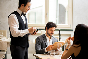 Waiter at a restaurant table